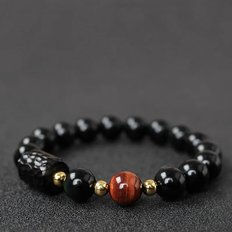 Handcrafted obsidian bracelet with 10mm yellow tiger eye beads on elastic cord