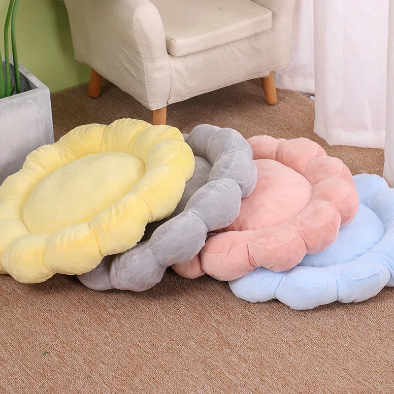 Blue half-surrounded petal-shaped pet bed for dogs and cats on a wooden floor