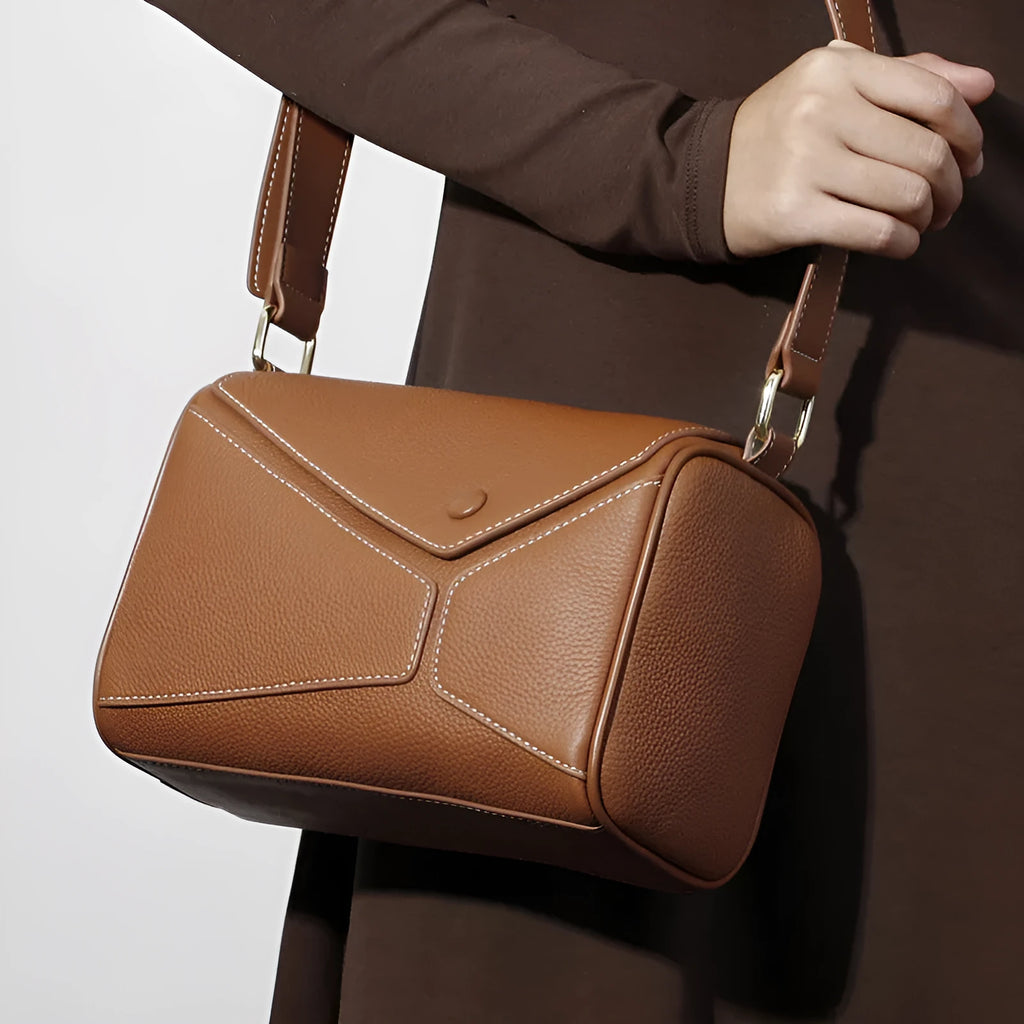 Women's genuine leather crossbody bag in soft first layer cowhide, square shape, 22x11x15cm, black colour option on a plain background