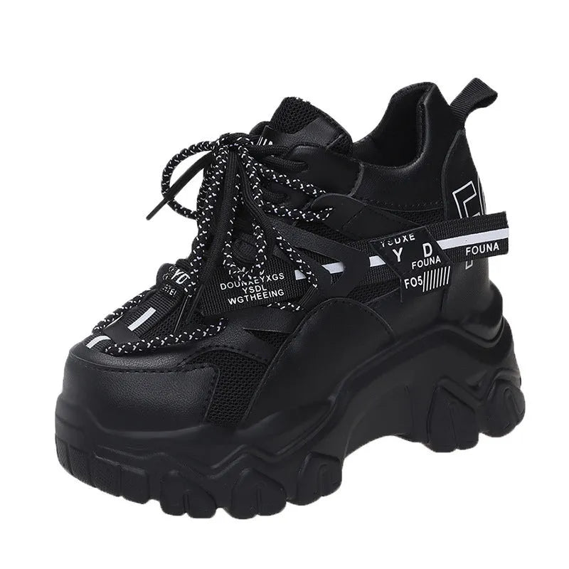 Women's white and black breathable mesh platform sports shoes with cross-strap and rubber sole.