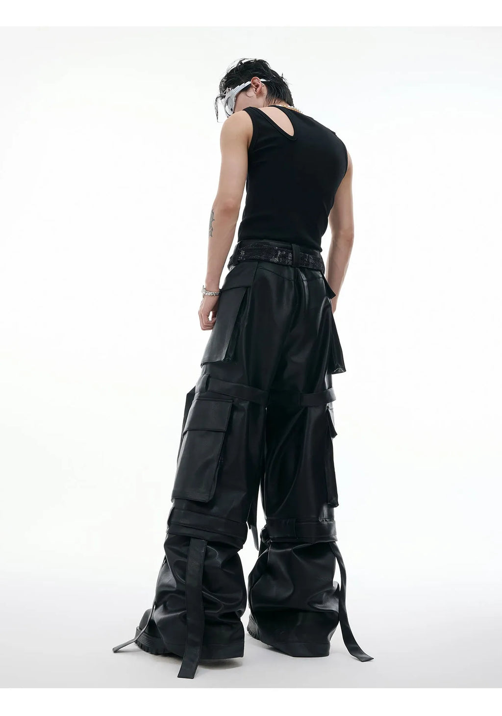 Black quilted loose-fit trousers with multiple pockets and leather-like appearance