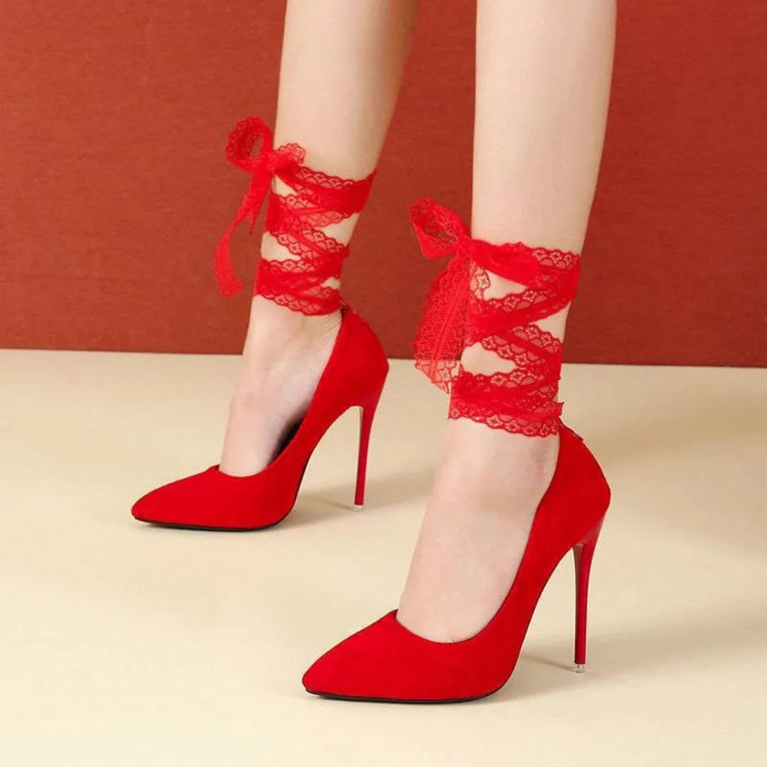 Black and red pointed toe high heels with thin straps and a shallow mouth, shown with flat buckle.