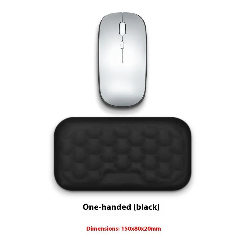 Cowhide keyboard wrist rest with non-slip base on a desk, featuring a black keyboard tray for office typing comfort