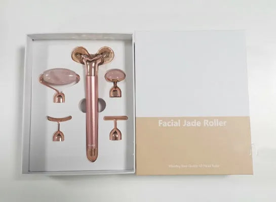 Rose gold five-in-one vibrating face massager with jade roller, disc, U-shaped and T-shaped beauty heads in colour box