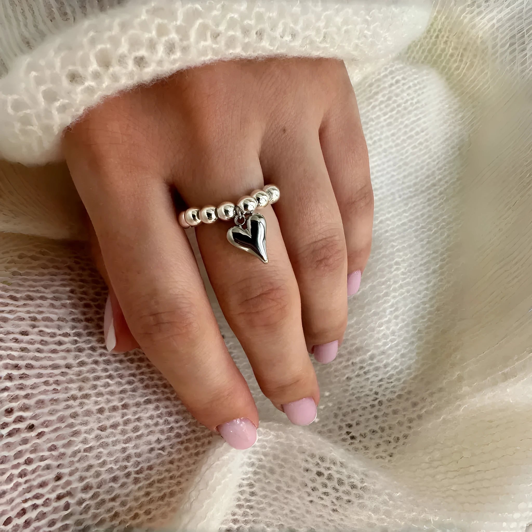 Handmade elastic beaded ring with love heart design in gold or white colour