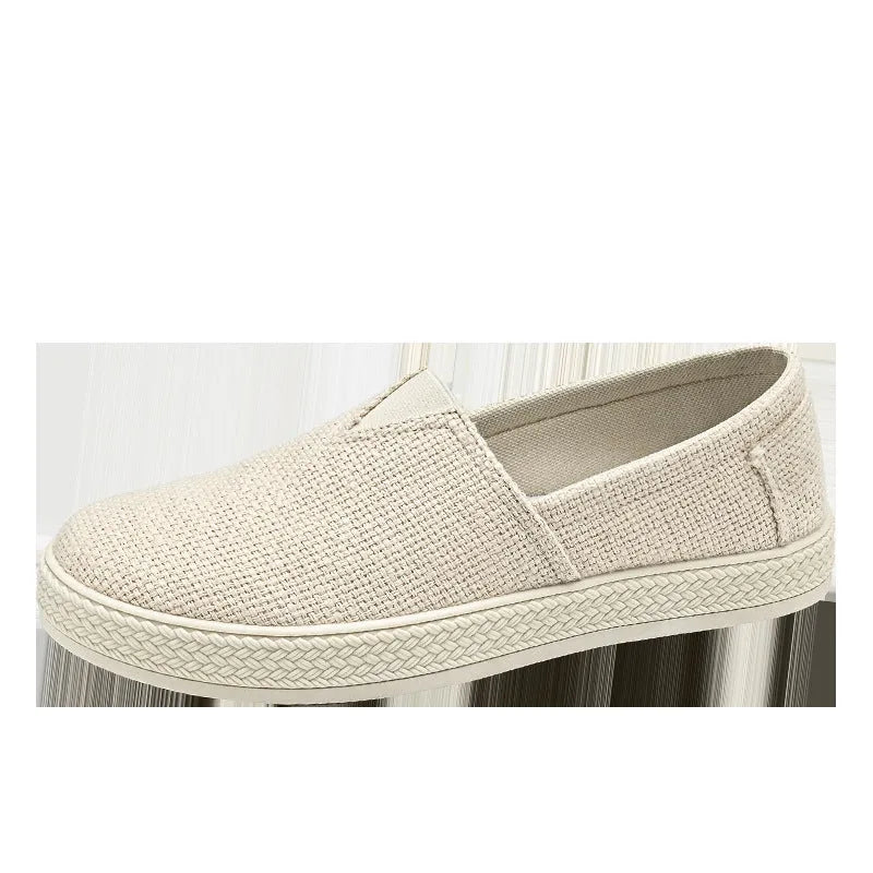 Men's beige linen cloth shoes with canvas upper and PVC sole on a plain background.