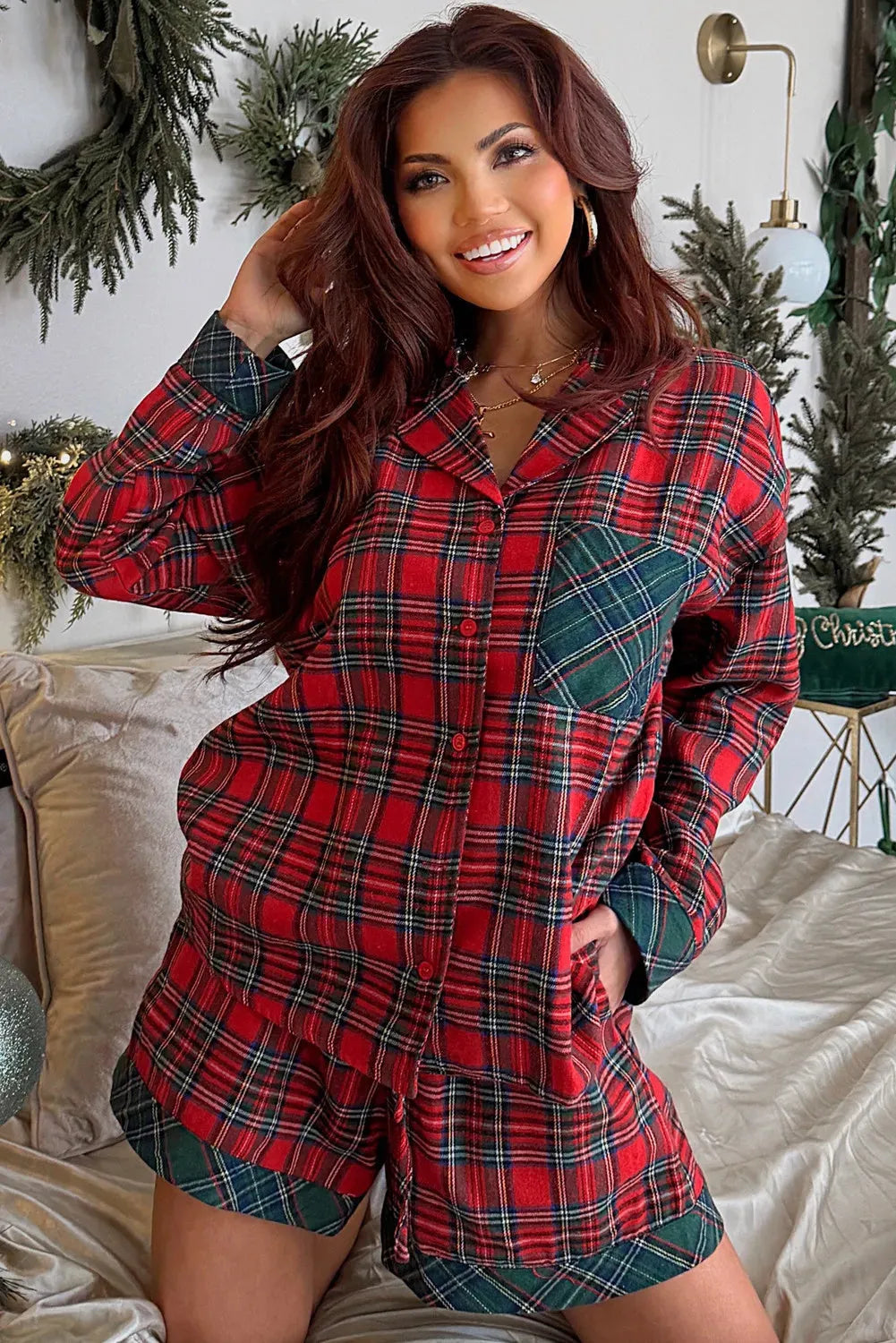 Red plaid Christmas pyjama set with long sleeve shirt and shorts.