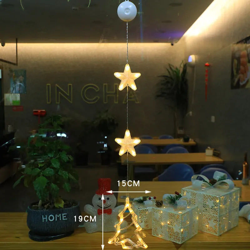 Christmas LED window light with suction cups showing deer, bell, and tree designs