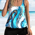 Blue tie-dyed women's floral two-piece swimsuit set with separate top and shorts.