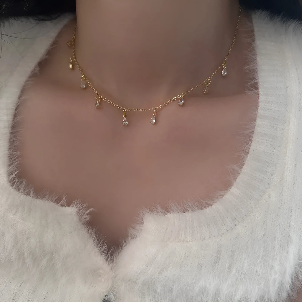 Zircon jewellery set showing necklace, earrings, and anklet with geometric meteor shower design