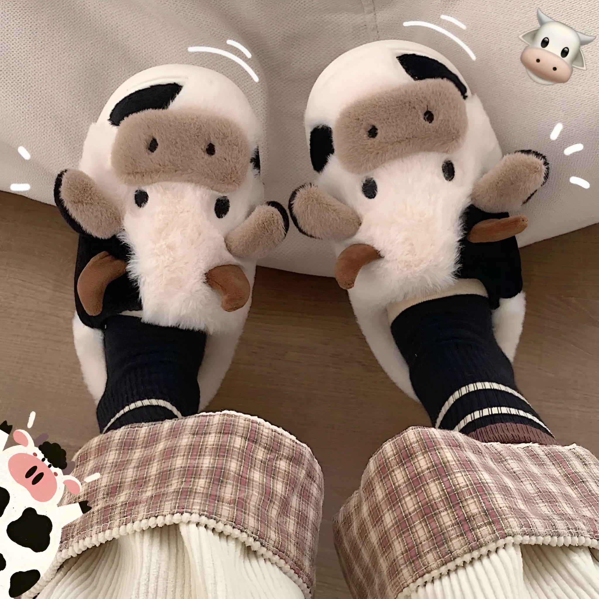 White women's cow pattern slippers made of soft faux fur with textured anti-slip soles.