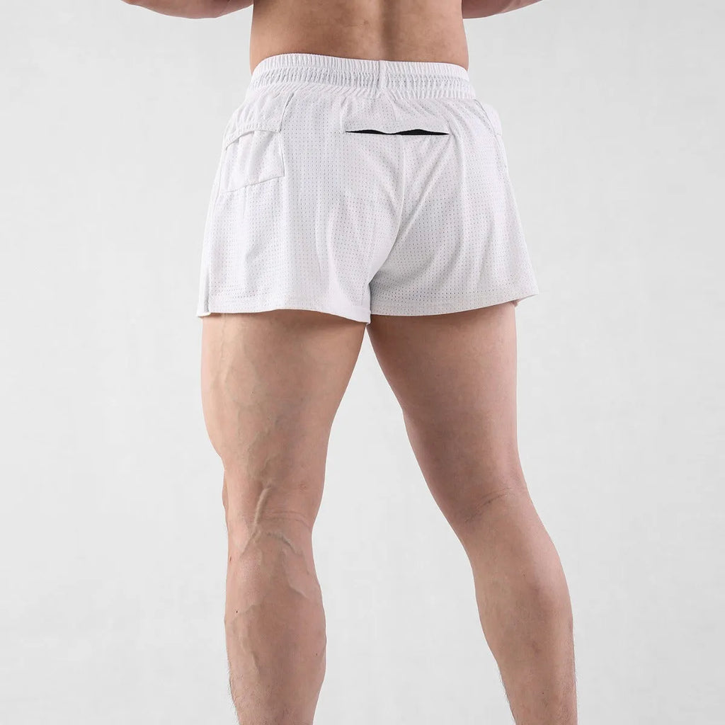 Men's quick-drying nylon shorts in black on a white background, showing mid-waist and short length.