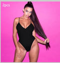 Backless one-piece swimsuit for women with string sides in a solid colour.