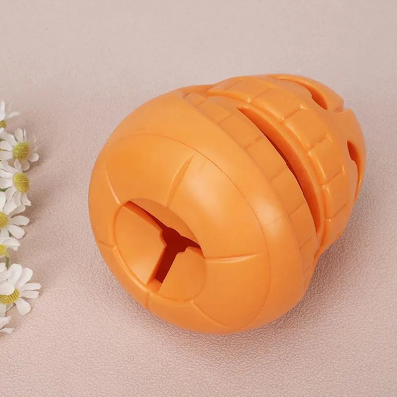 Yellow pumpkin-shaped TPR dog chew toy for aggressive chewers