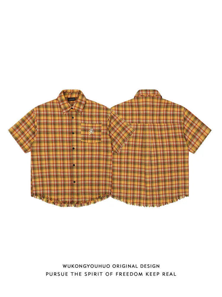 Yellow plaid short sleeve shirt with embroidered pocket detail in loose fit style