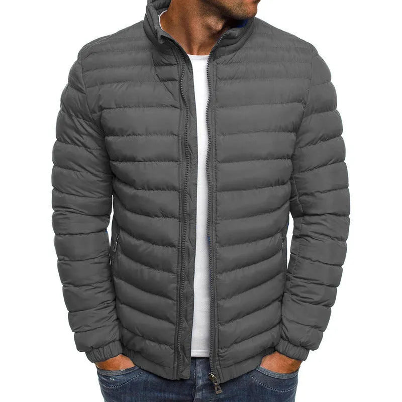 Men's thickened padded jacket with full-length zip, zipped pockets, and solid colour design in gray, black, or navy blue.