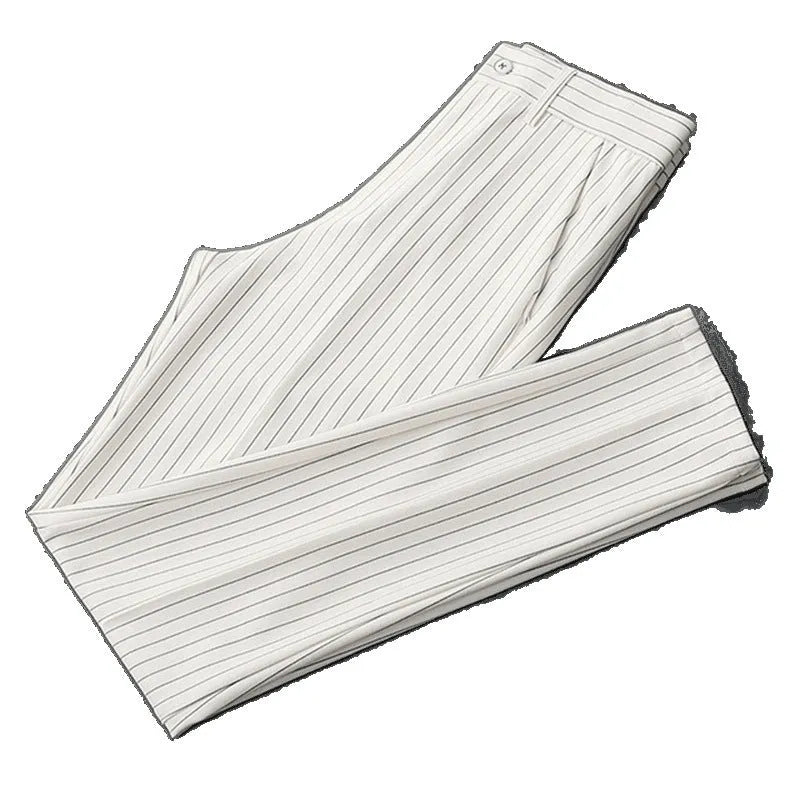 Men's loose draping suit pants in thin striped fabric showing trousers style and crop jeans cuts in black and white colours