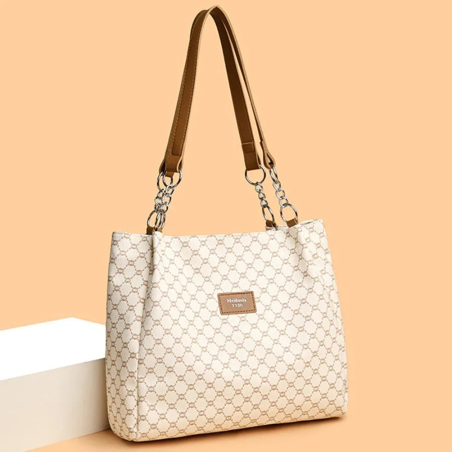 Women's retro fashion handbag in soft brown PU leather with shoulder strap.