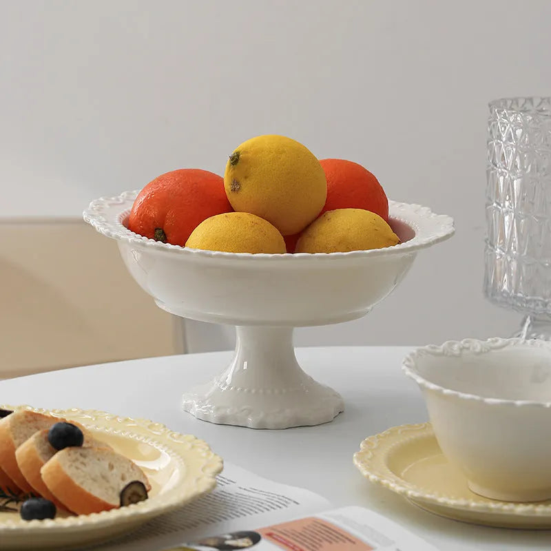 Cream ceramic vintage lace plate with irregular shape and glazed finish in white