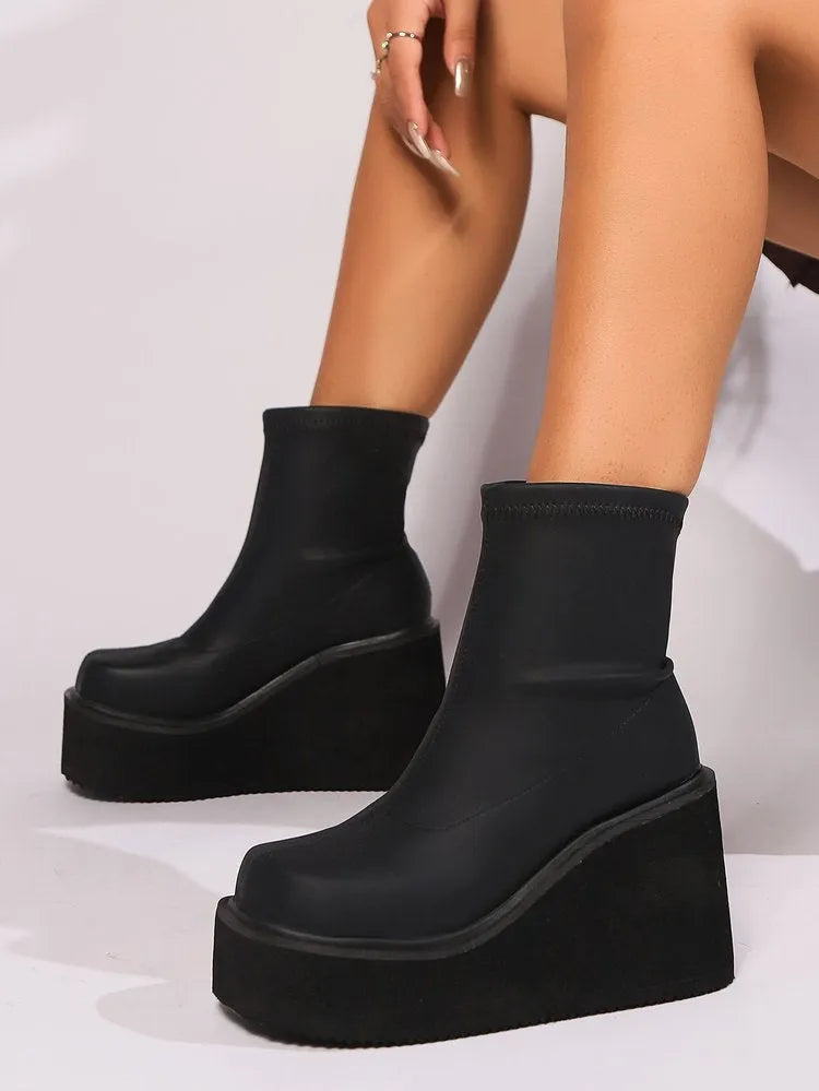 Women's plus size black wedge heel boots with waterproof platform and round toe design