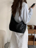 Female retro casual large capacity single shoulder crossbody bag in PU leather, brown, with sewing line detail and dumpling shape