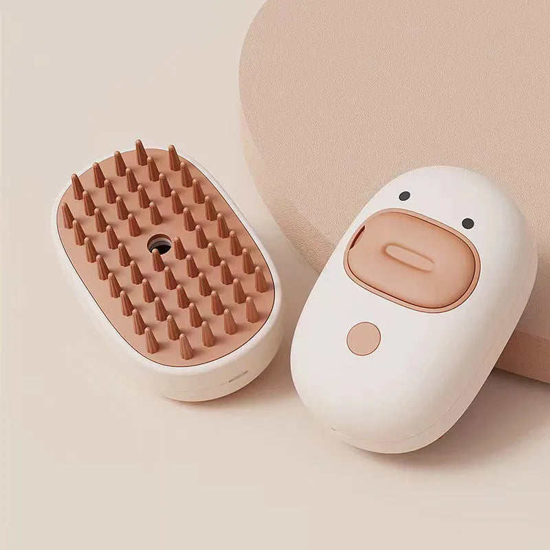White rechargeable pet steam grooming brush for dogs and cats with rubber comb teeth