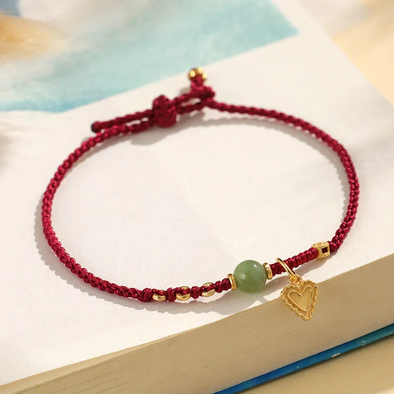 Handmade woven bracelet with 925 silver and Hetian jade, red carrying strap