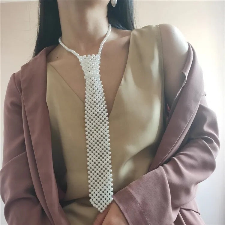 Women's pearl tie body chain with hollow-out design in white or black colour.