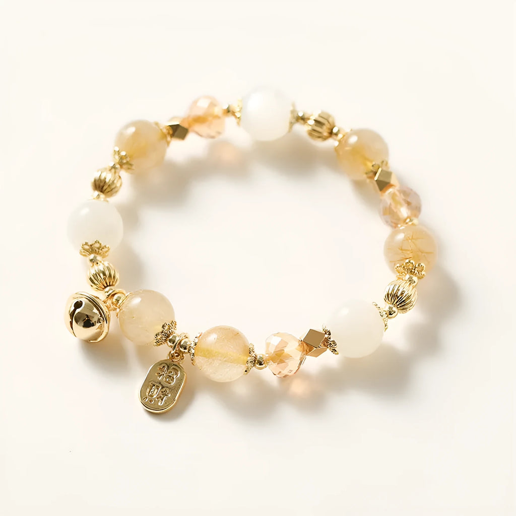 Adjustable gold tone bracelet with rutilated quartz crystal centrepiece and electroplated metal components