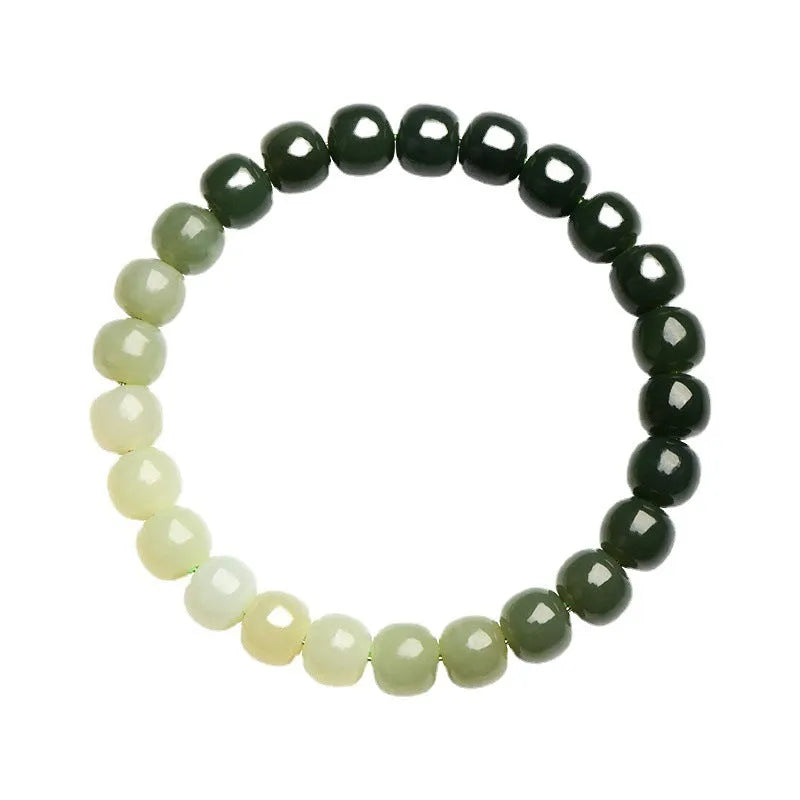 Polished Hetian jade bracelet with clear water gradient colour on wrist.