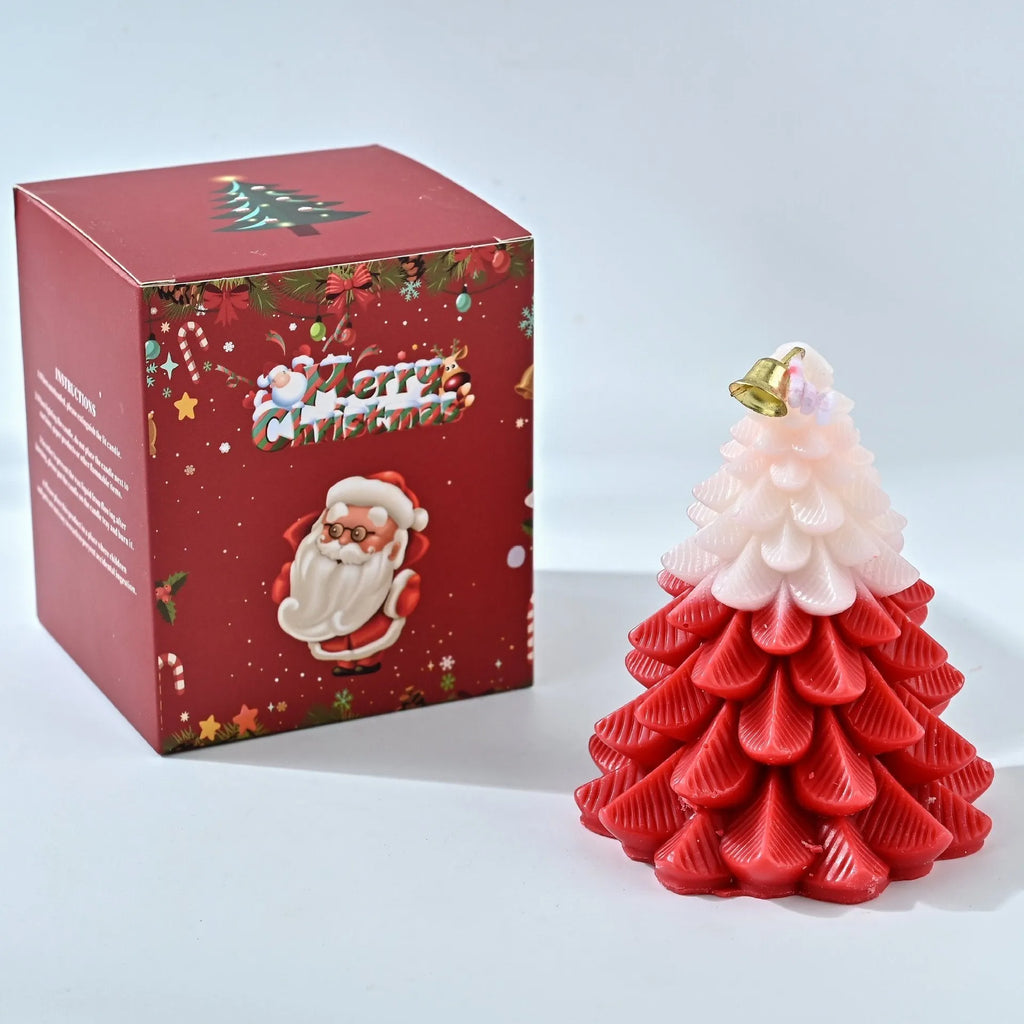 Christmas tree shaped soy wax aromatherapy candle in green on a table with festive home decoration