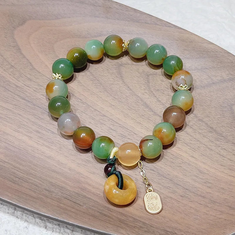 Yellow peacock agate bracelet with peace buckle clasp and old mine topaz stones