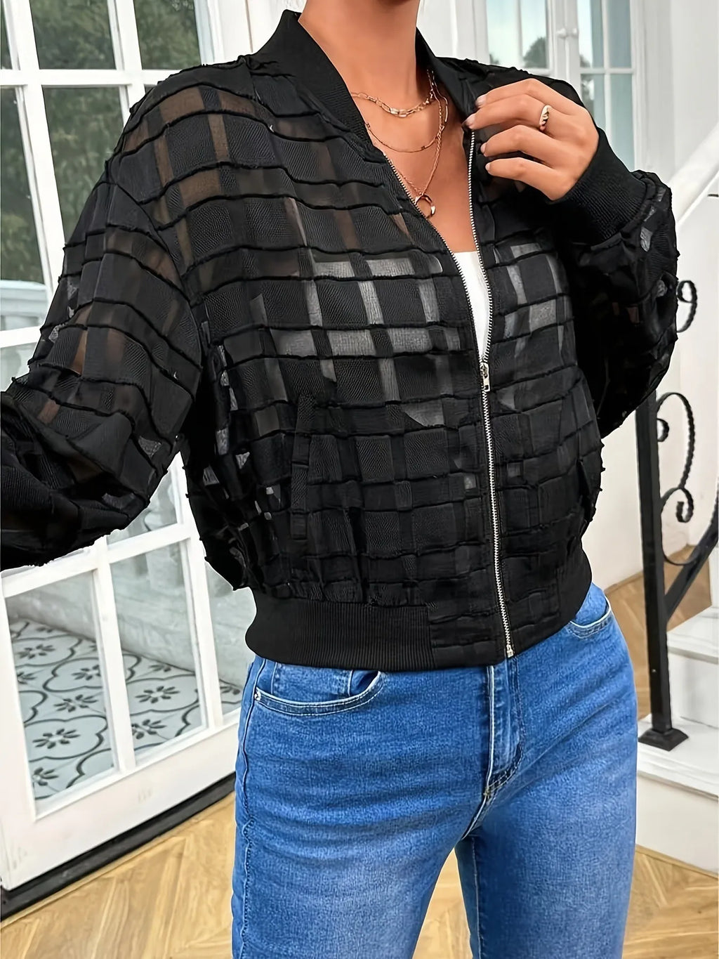 Black women's jacket with geometric pattern and front zipper