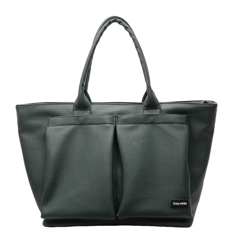 Sporty green PU shoulder bag with adjustable straps showing expandable compartments.