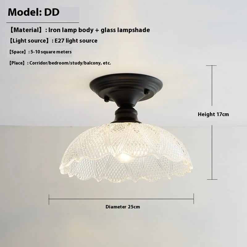 American retro style single-head ceiling or wall lamp with a glass cover.