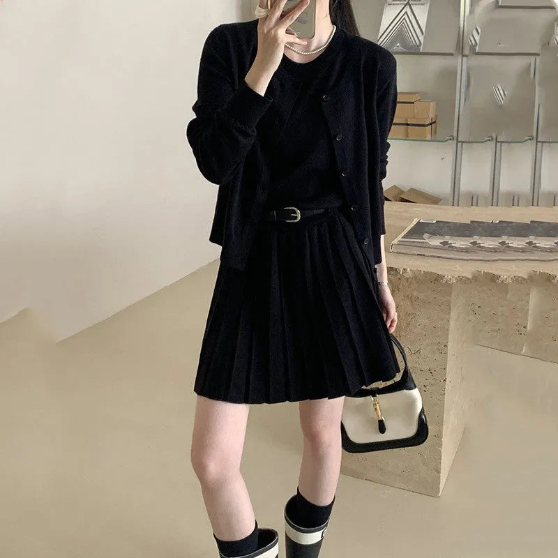 Grey Art Retro style women's knitted vest skirt and long-sleeved cardigan two-piece set with a 3D pattern.
