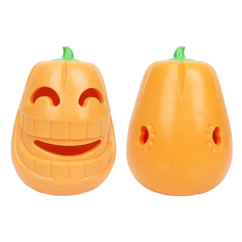 Orange Halloween pumpkin shaped durable thermoplastic rubber dog chew toy with a treat-dispensing funnel.