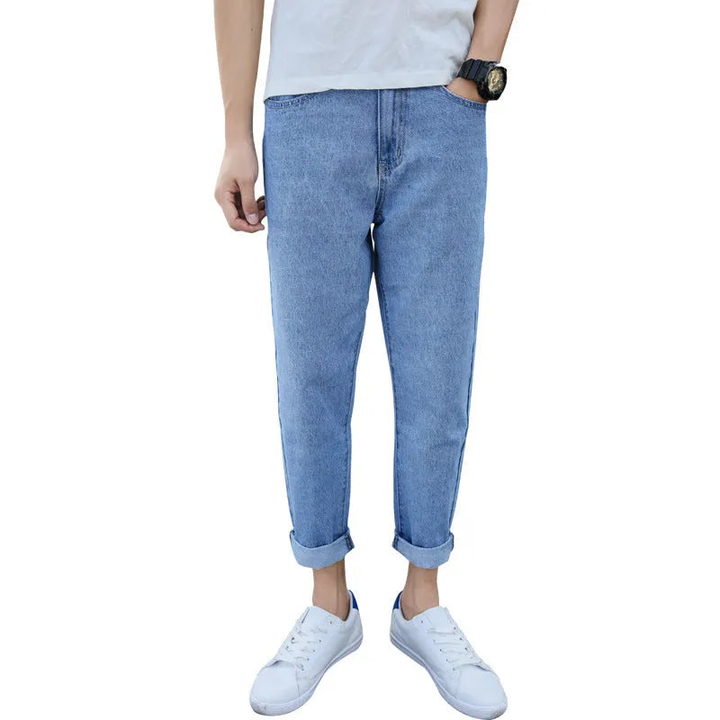 Men's black loose straight leg harem jeans on hanger