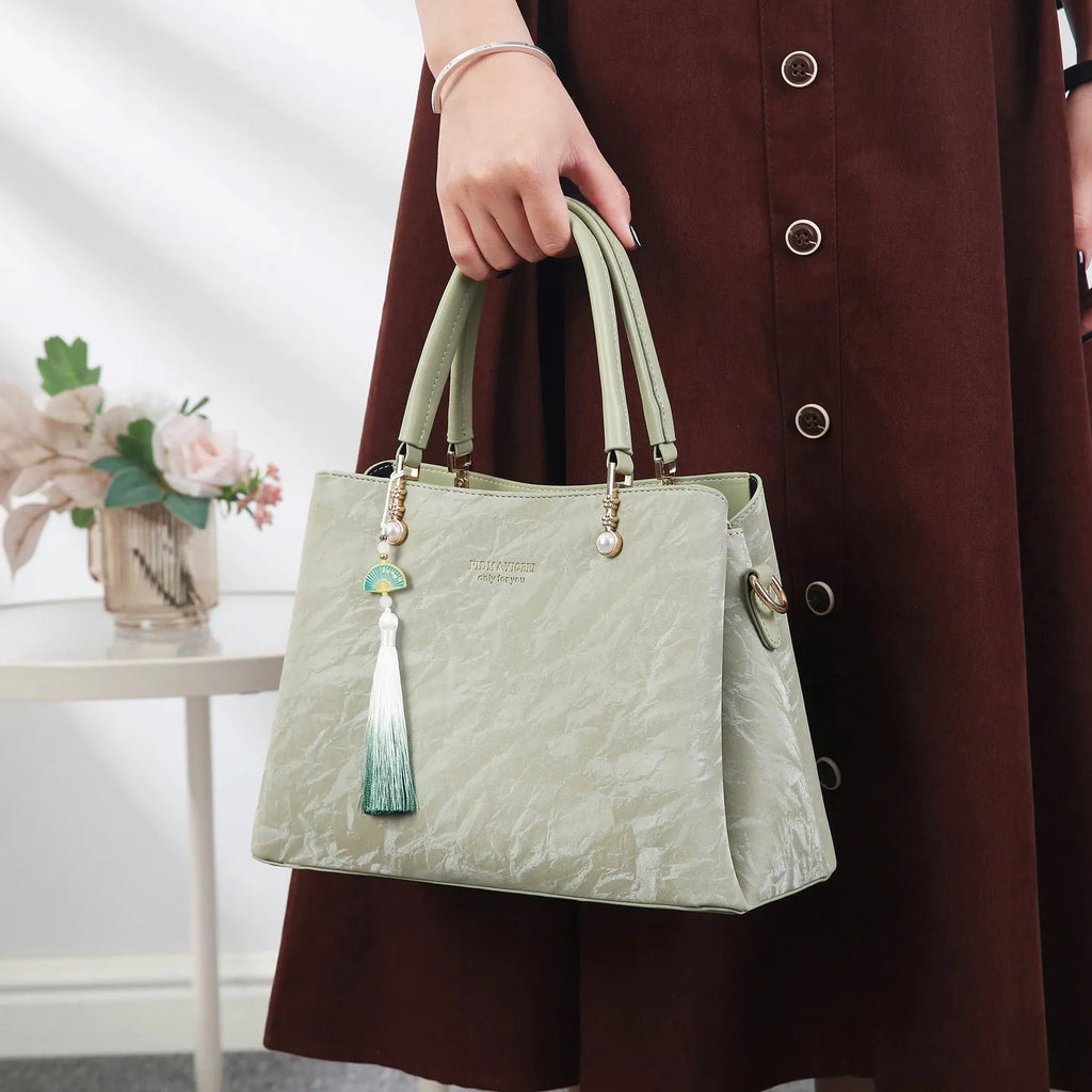 Women's square shoulder bag in PU leather with ethnic detailing and slit pocket