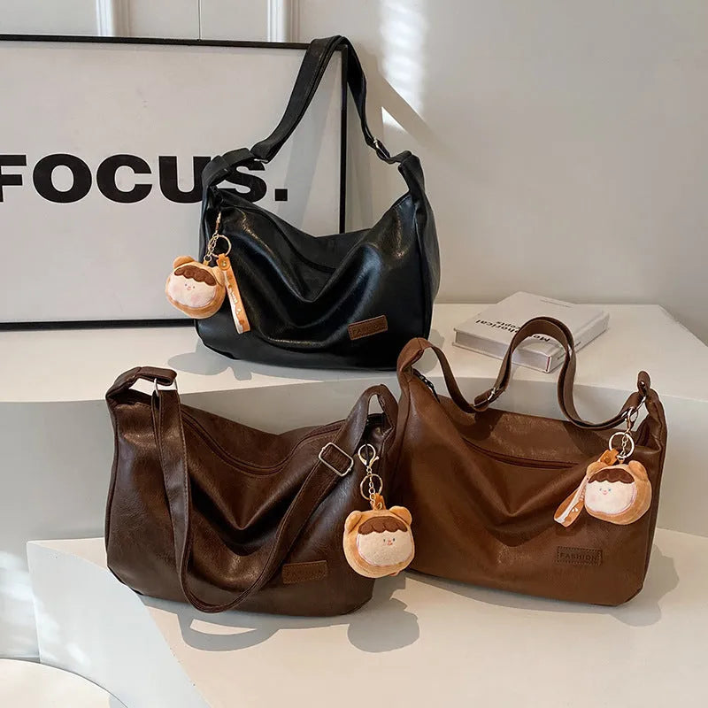 Retro PU shoulder messenger bag in dumpling shape with open pocket and sewing thread detail, black brown coffee options.