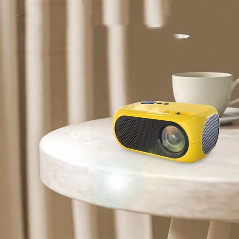M24 portable mini LED projector in gold or white, showing compact size and included accessories.