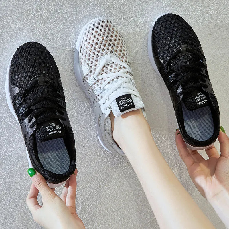 Breathable hollow out mesh casual sneakers in black and white colours with round toe design