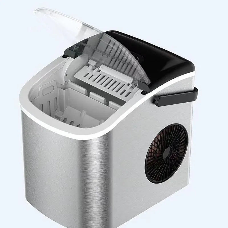 Silver countertop home ice machine with 1.2L capacity and push-button control on a kitchen counter