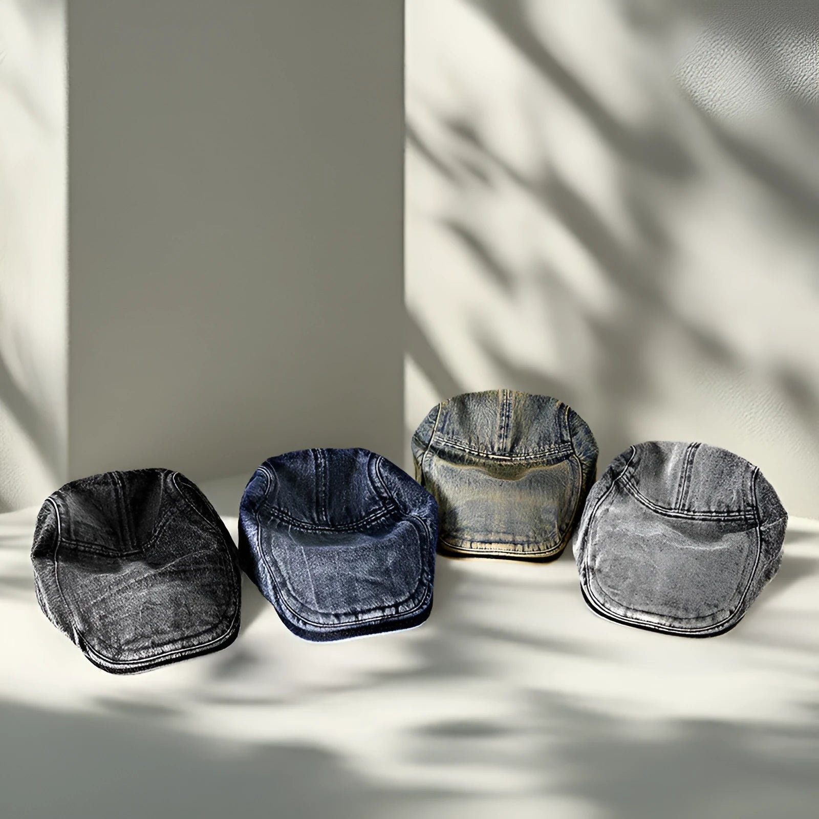 Men's flat top denim cap in wash-treated cotton fabric on a neutral background.