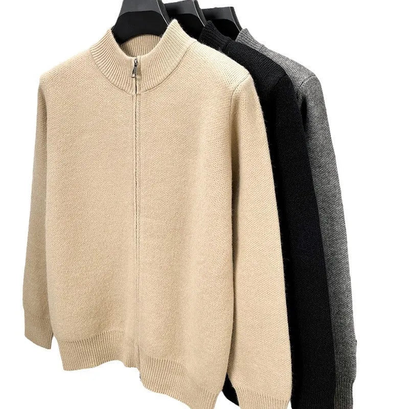 Man wearing a grey stand collar knitted cardigan with a front zipper.