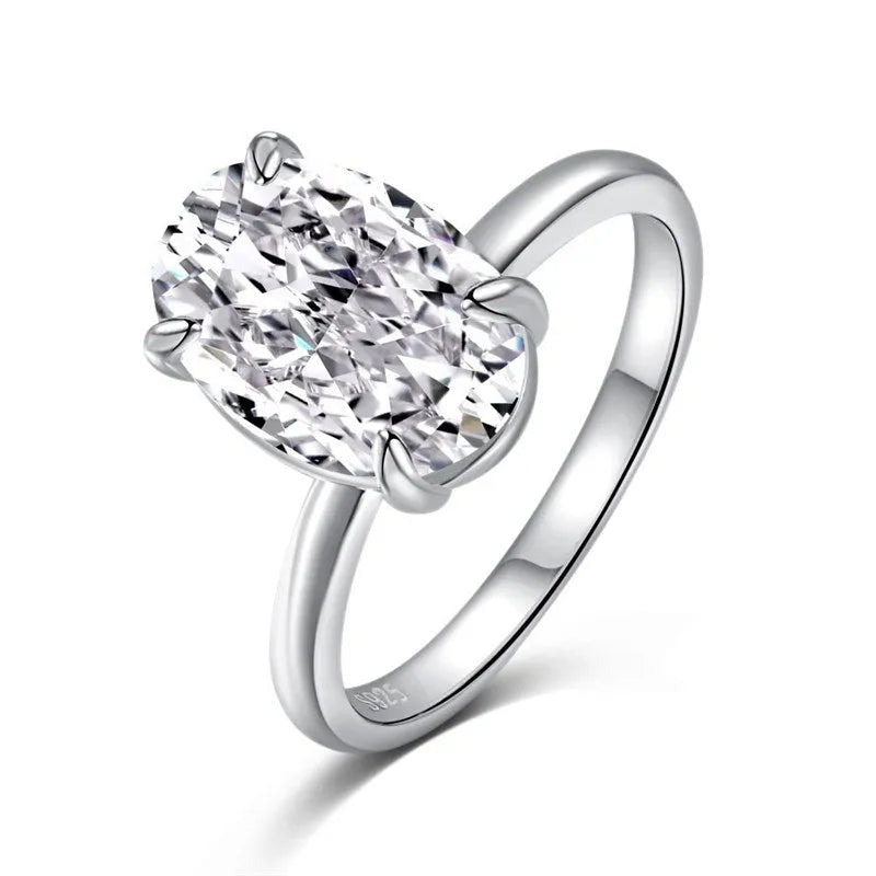 Women's oval ring with four-claw setting in gold or silver colour, 6x9mm gemstone