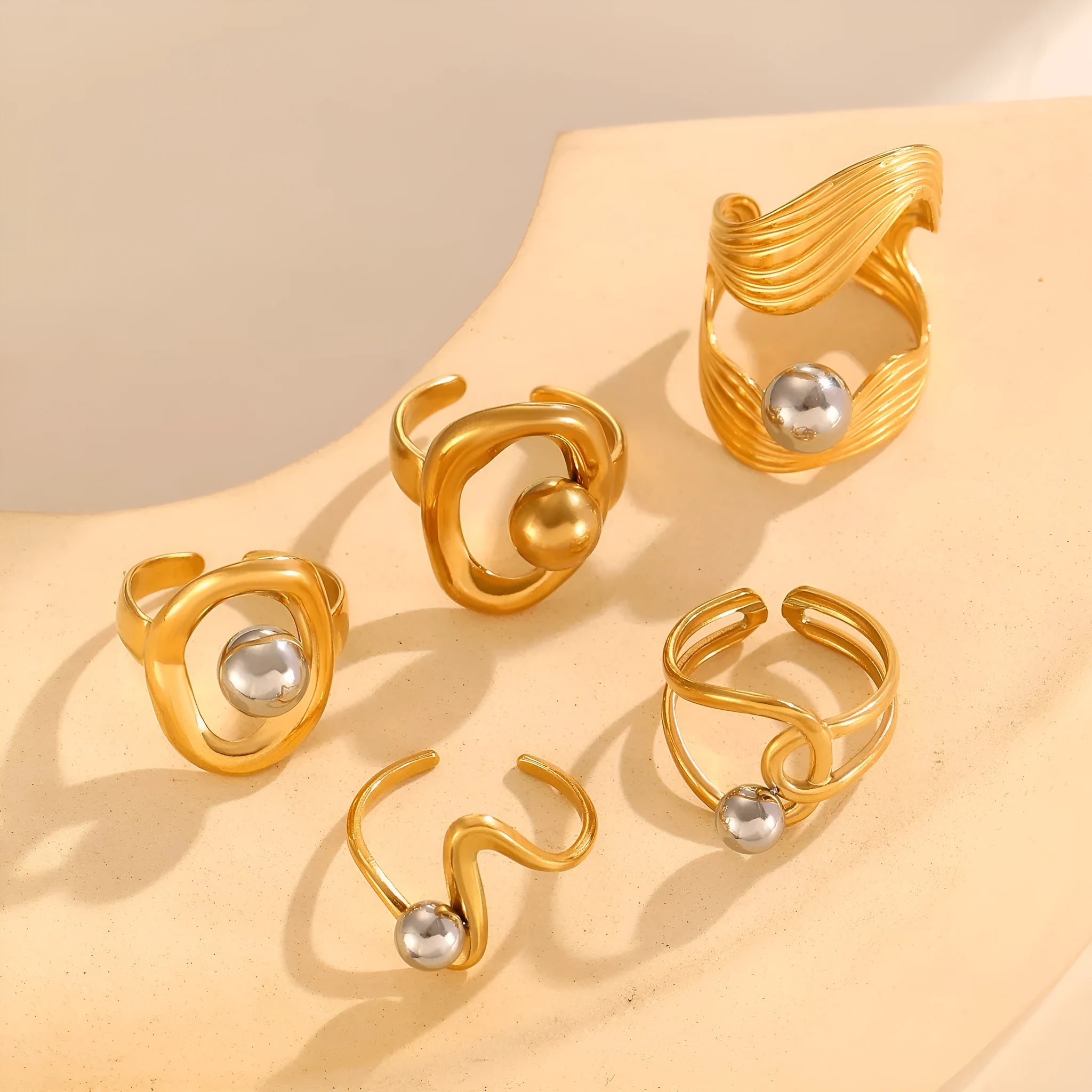 Geometric hollow line open ring in 304 stainless steel with 18K real gold finish, ellipse design