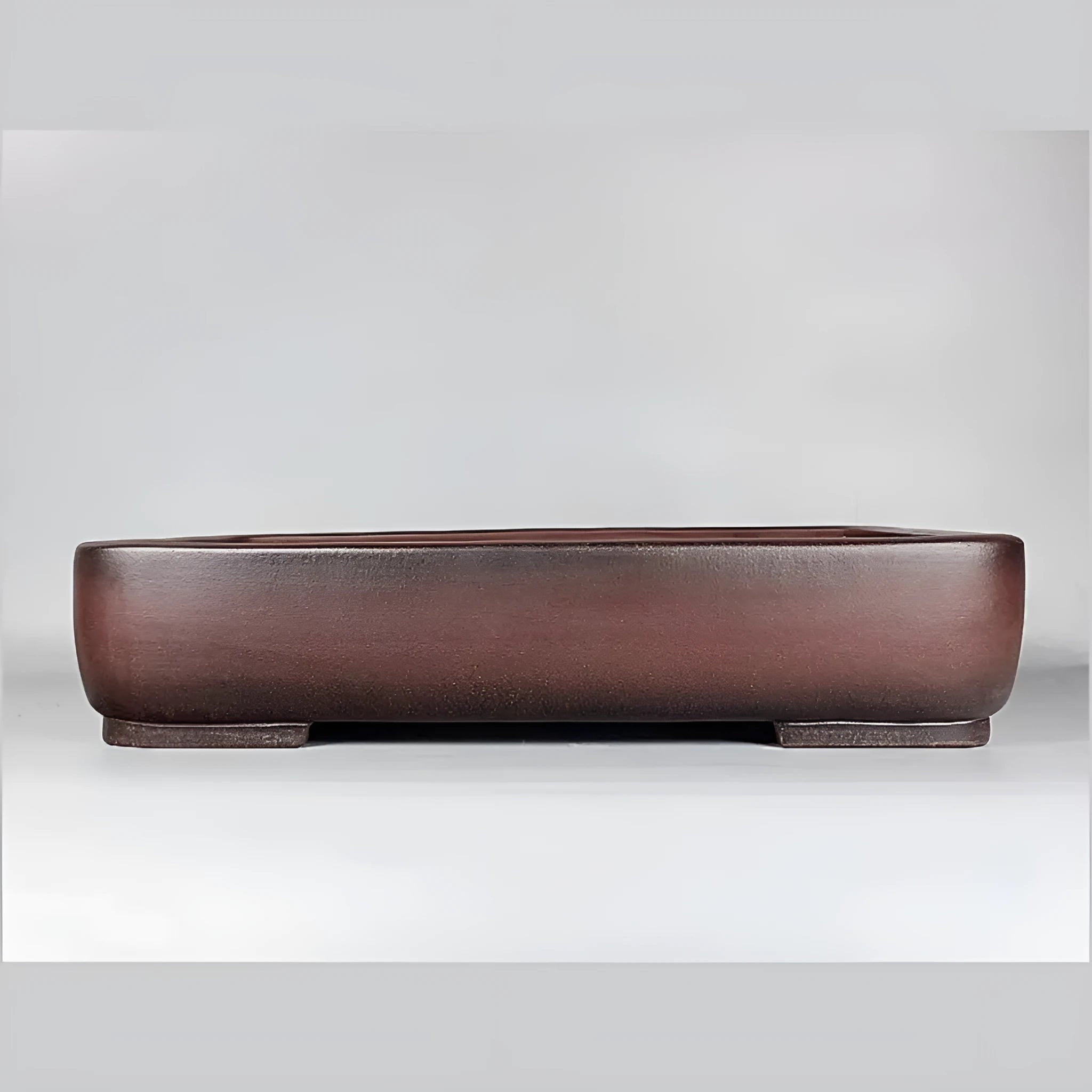 Handmade rectangular purple clay flower pot with antique finish showing internal planting space
