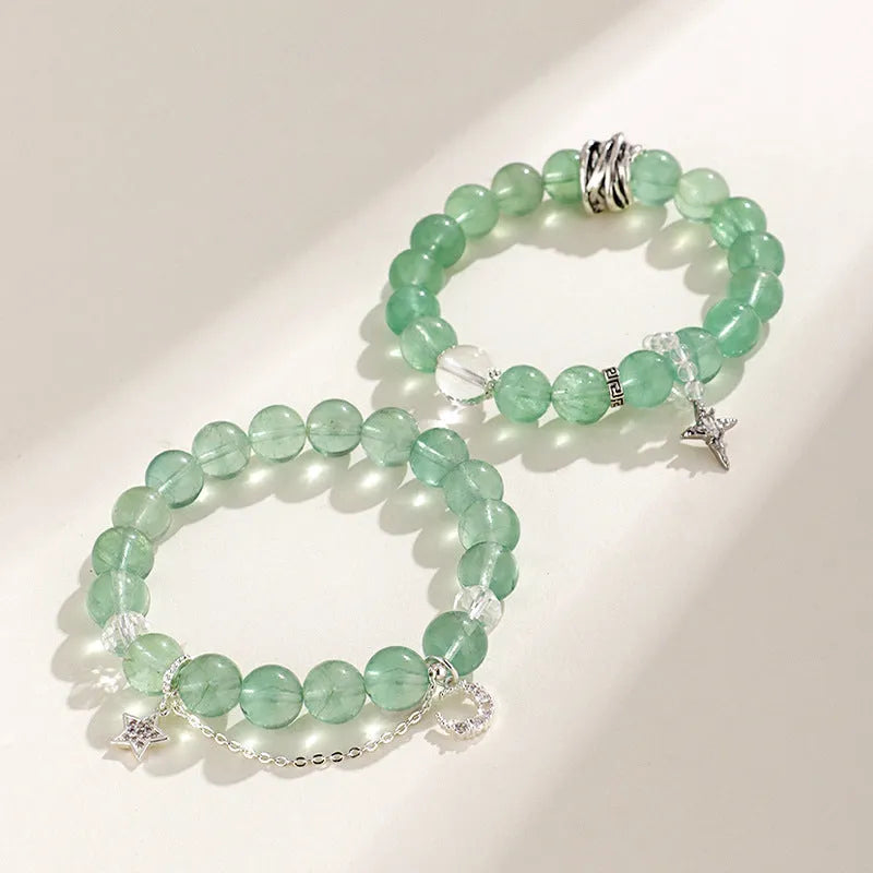 Green fluorite and white crystal star moon princess bracelet with electroplated setting and diamond-shaped stones.