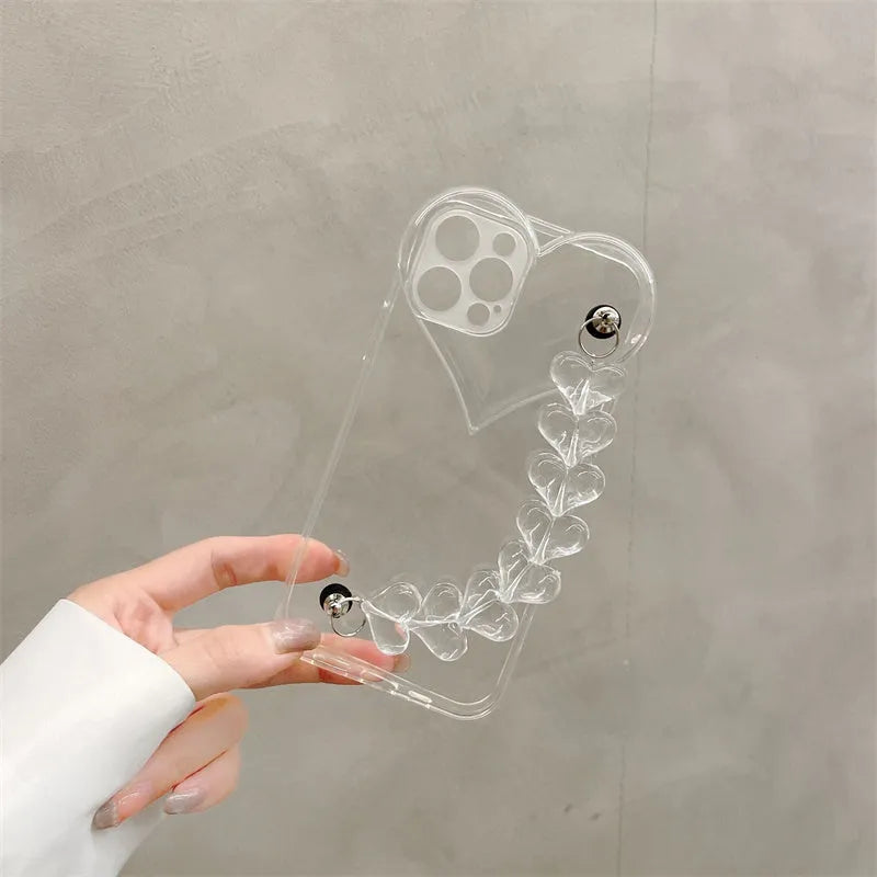 Transparent clear iPhone case with a love heart chain design on a smartphone.